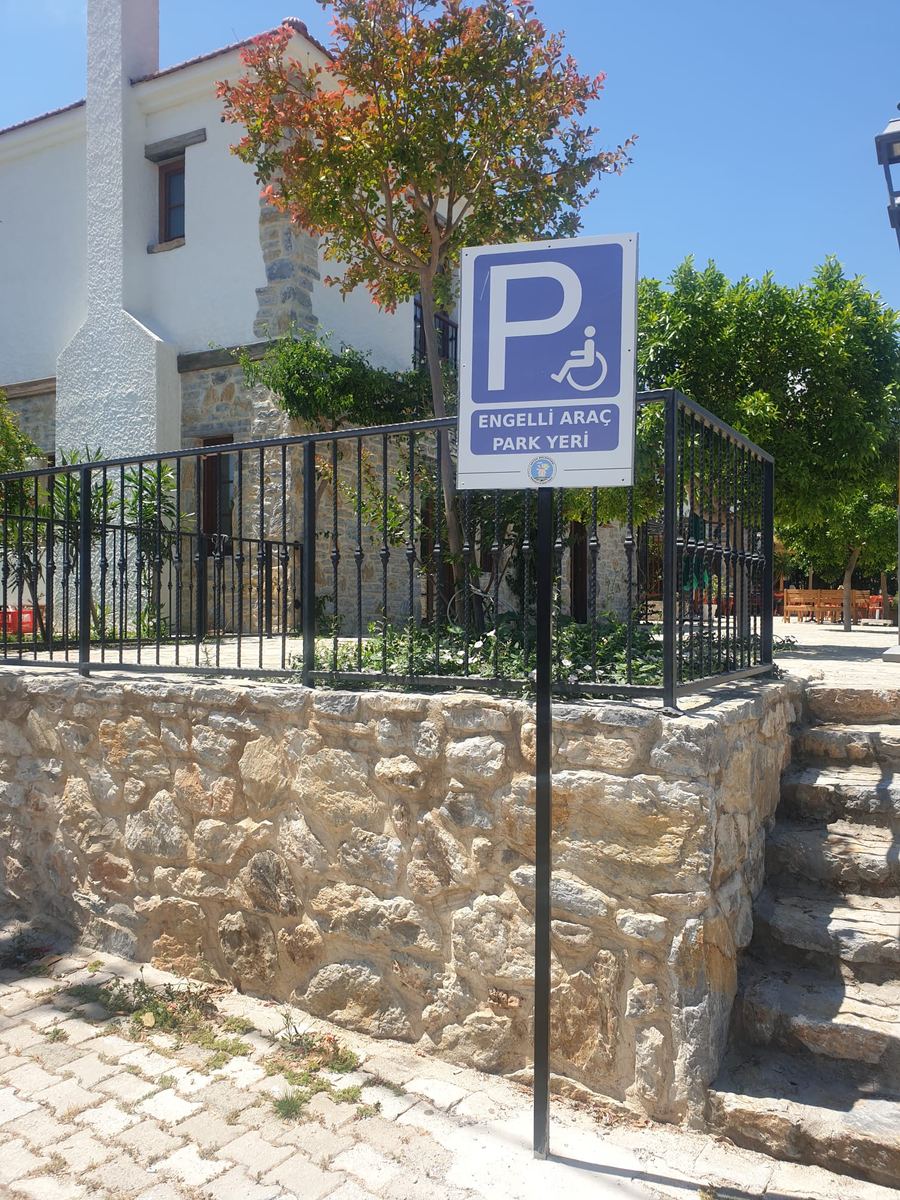 Reserved parking space near the village square signed as accessible parking